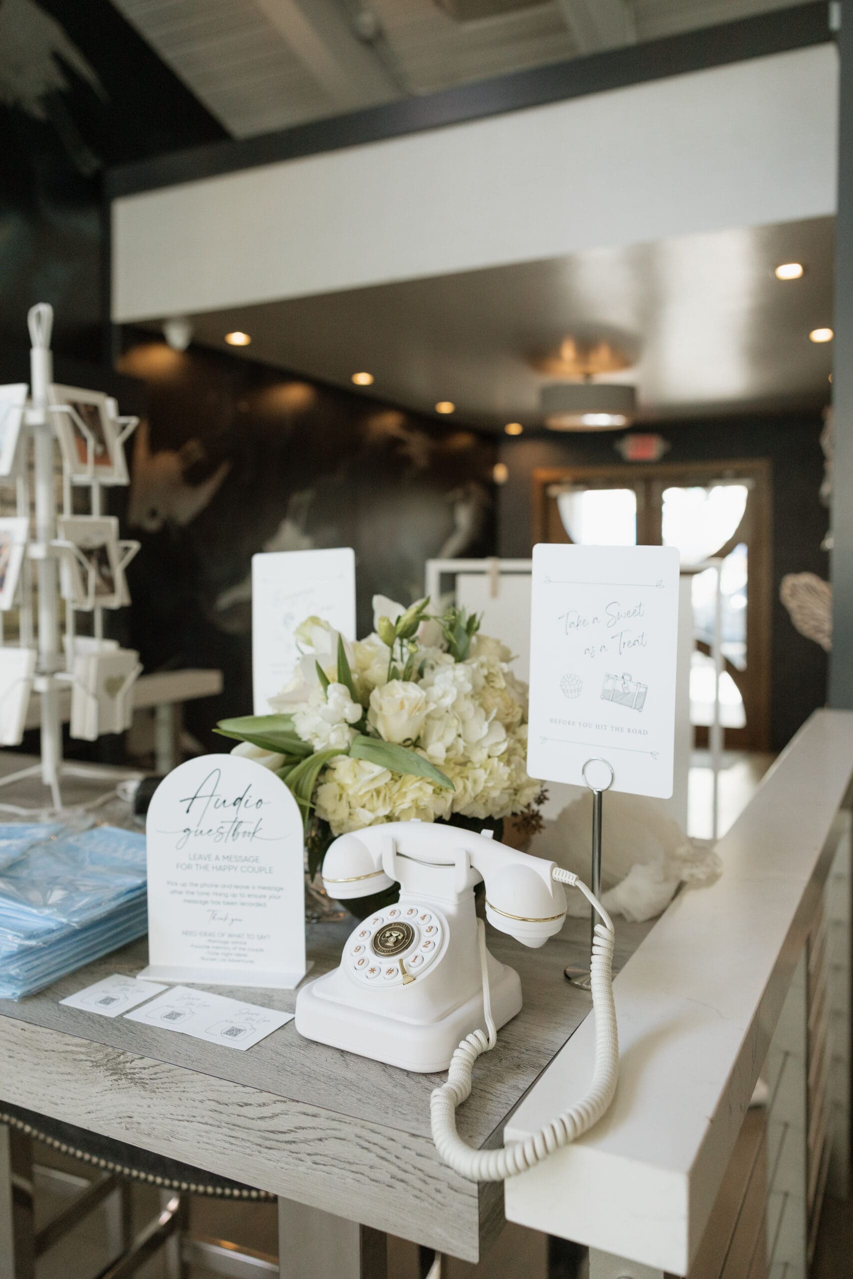 Vintage white rotary phone audio guestbook at intimate wedding reception, Grateful Palate Fort Lauderdale