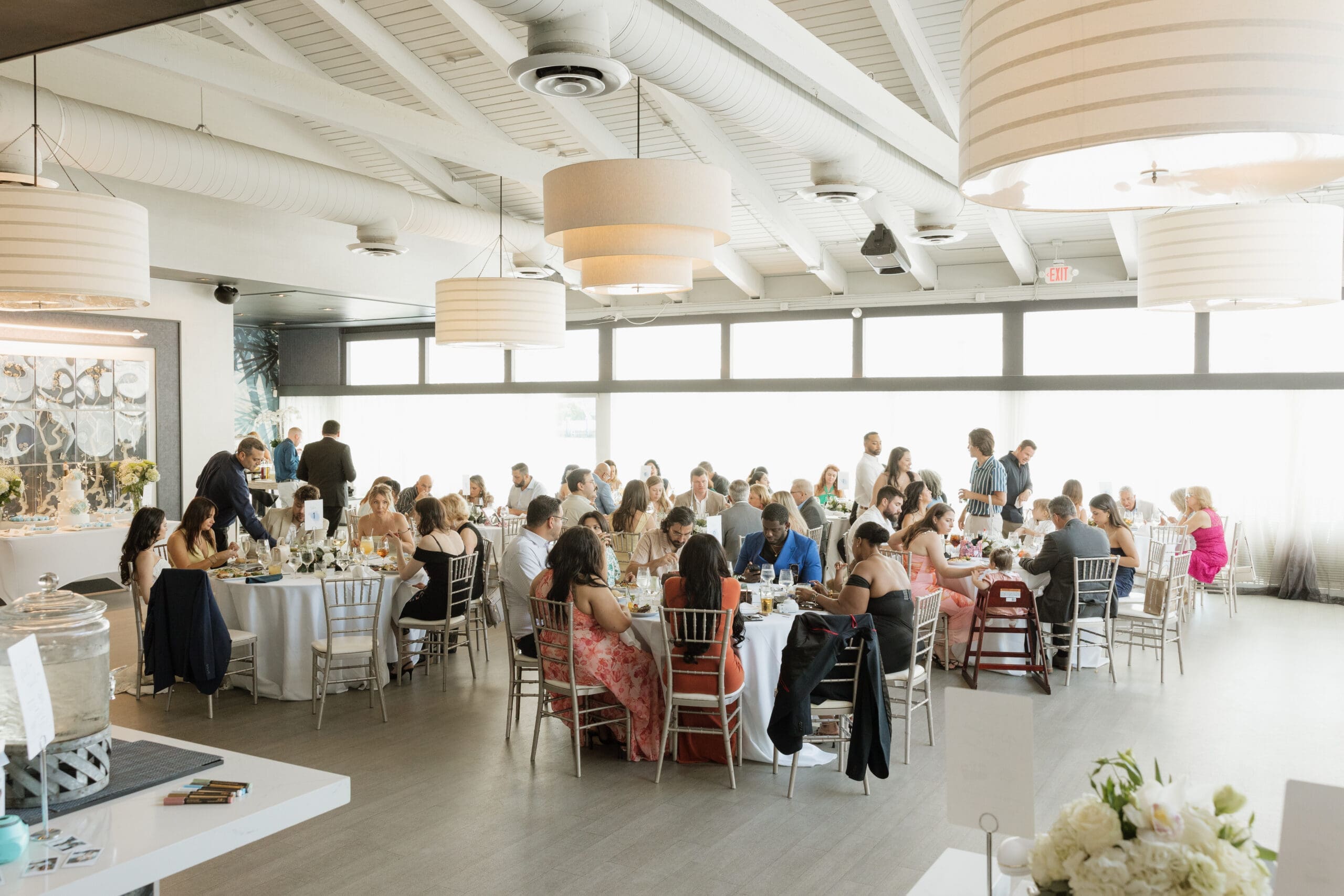 Full wedding reception room with guests dining at Grateful Palate Fort Lauderdale